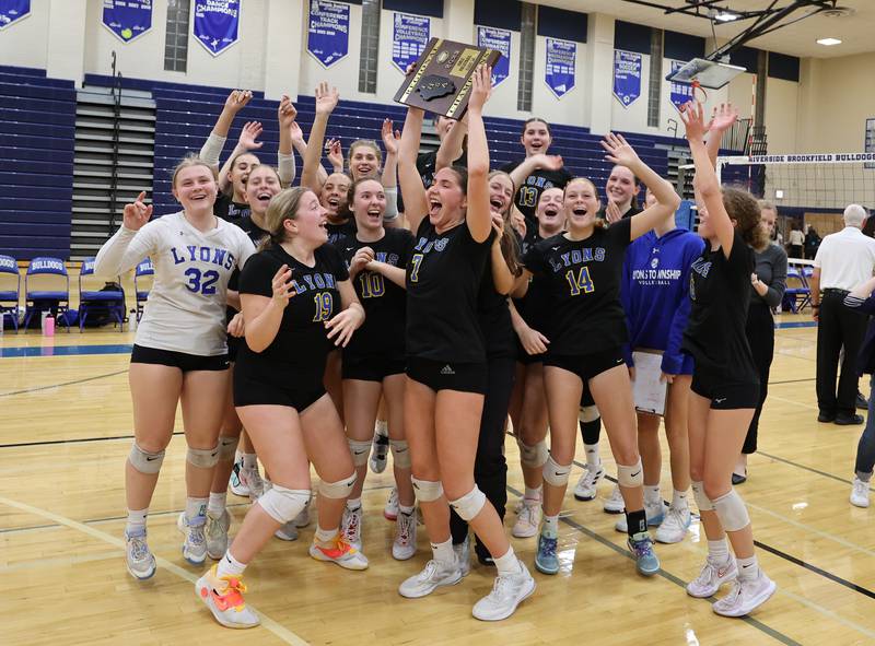 Lyons Township celebrate after winning against Downers Grove North at the 4A girls varsity volleyball regional final match at Riverside Brookfield high school on Thursday, Oct. 26, 2023 in Riverside, IL.