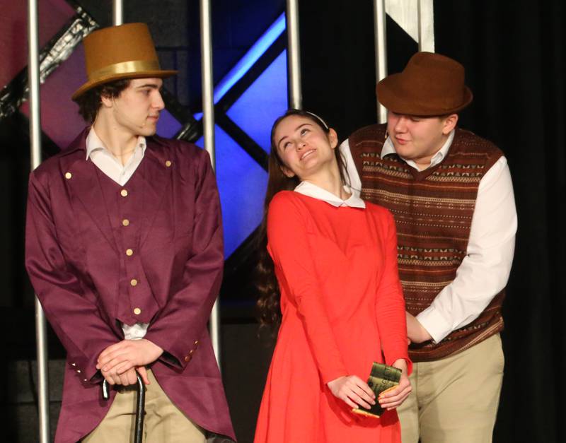Willy Wonka, played by Mavrick Holocker,  Maddy Wasilewski and Grandpa Joe, played by Eric Vipond act out a scene during a performance of Willy Wonka on Thursday, March 16, 2023 at Putnam County High School.