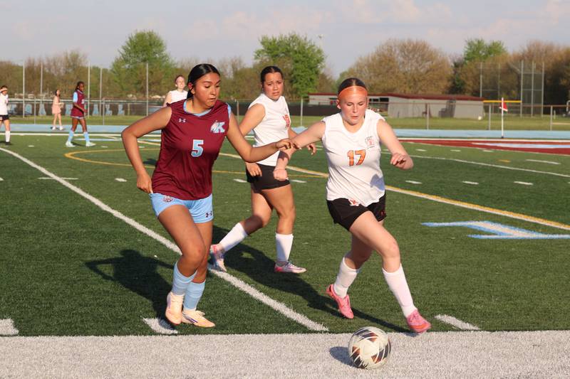Kankakee's Elizabeth Avalos, left, defends Beecher's Sydney Kettman during Kankakee's 8-4 victory over Beecher on Wednesday, April 22, 2026.