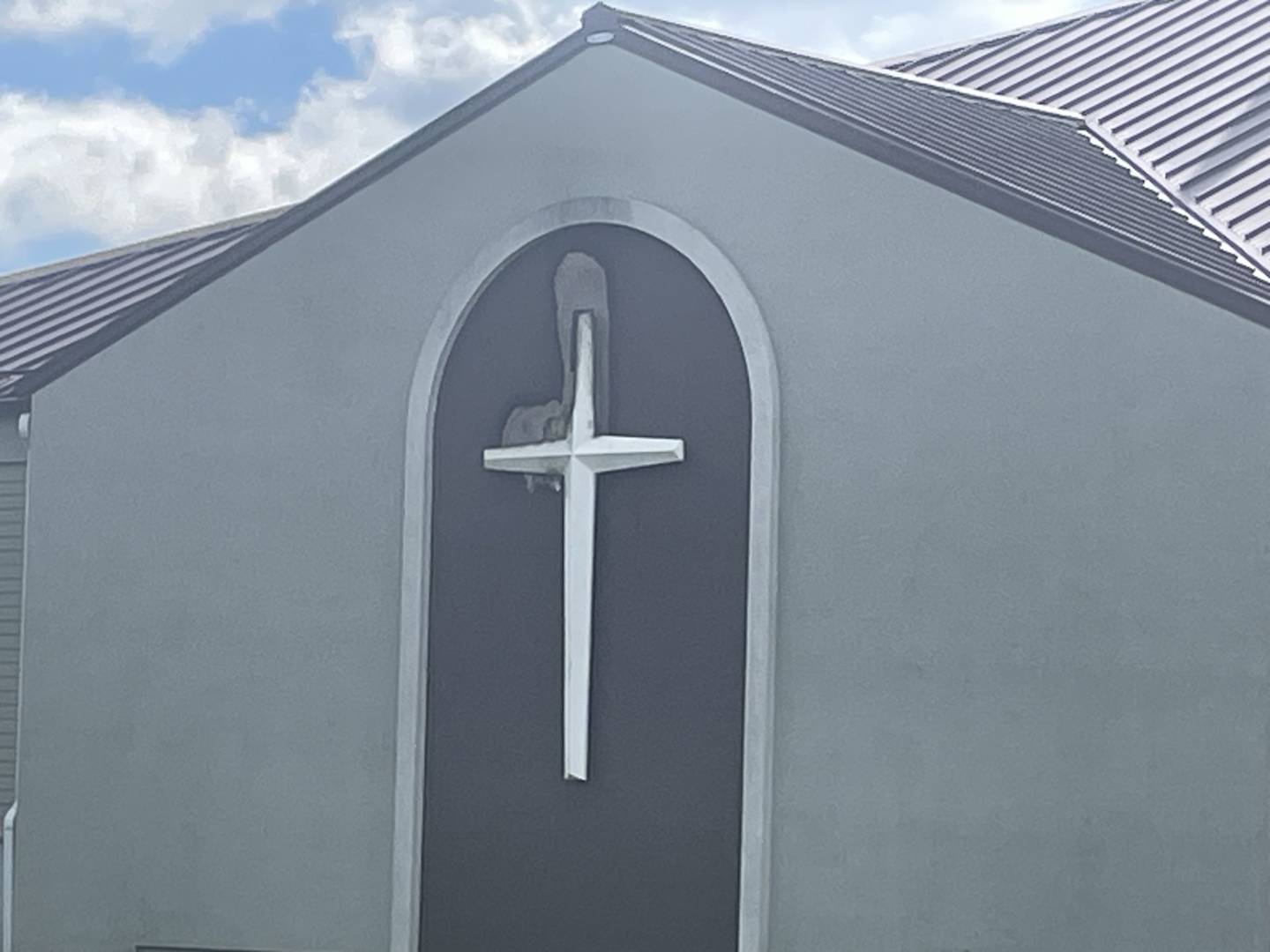 See the scorch marks around the arm of the cross? The damage at Faith Church on Wenzel Road in Peru, reported early Sunday, April 5, 2026, would have been worse had a passing motorist not spotted smoke and called Peru Fire Department.