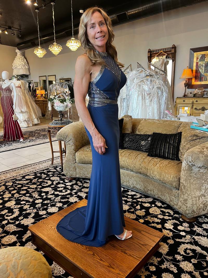 Russella Lazarich is modeling fashions provided by Emma's Elegance in Bourbonnais. Lazarich is owner of A Touch of Glass Cleaning Services and Hansen's Window Covering and Reupholstery.