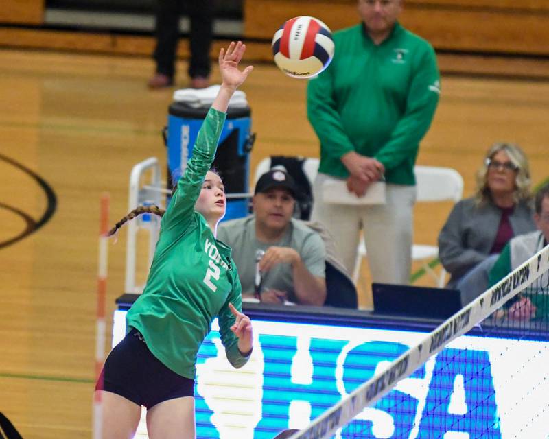 York's Eileen Carroll (2) spikes the ball over the net on Thursday Oct. 30, 2025, while taking on Lyons township during the regional title game held at York High School.