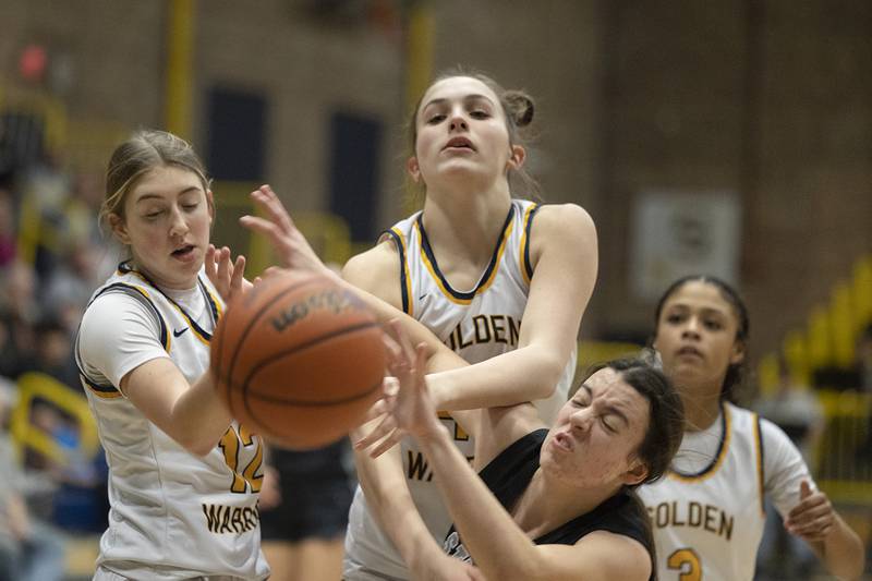 Sterling’s Olivia Melcher (eft) and Madison Austin go for a rebound against Galesburg on Wednesday, Feb. 8, 2023.