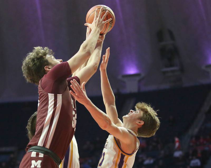 Moline's Owen Freeman grabs a rebound over Downers Grove North's Owen Thulin during the Class 4A state semifinal game on Friday, March 10, 2023 in Champaign.