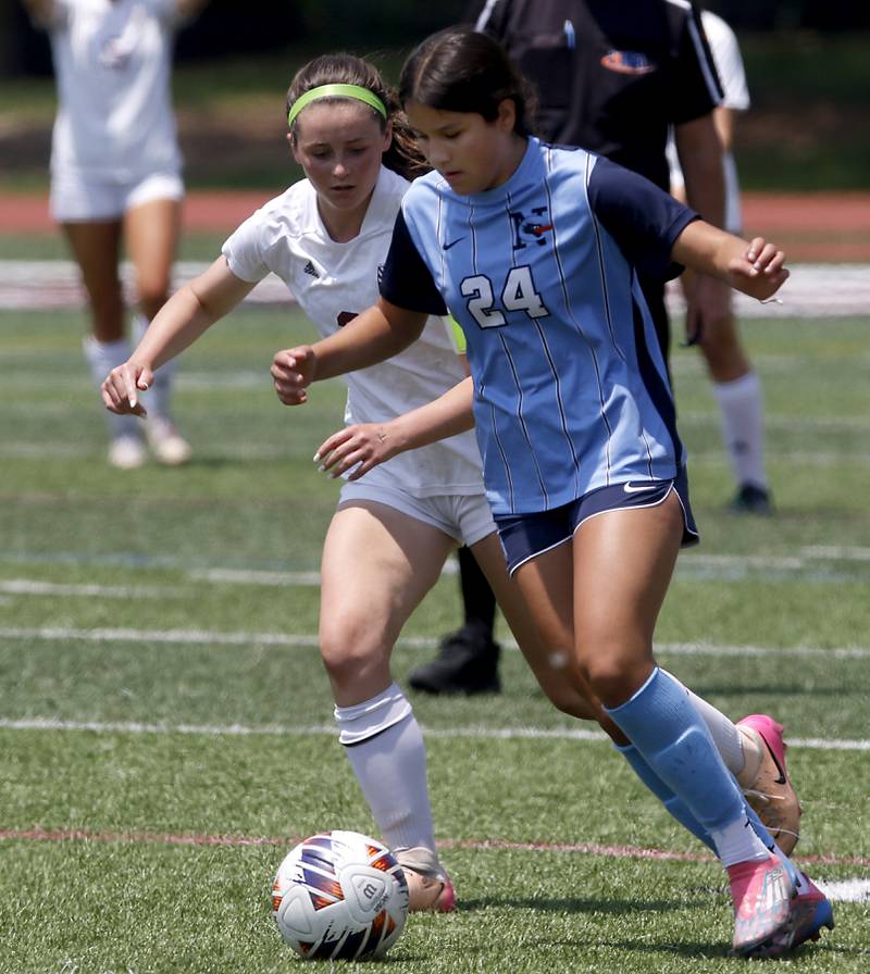 Nazareth Academy's Daniella Berruti controls the ball in front of St. Ignatius College Prep's Quinn Urquhart during a IHSA Class 2A State Girls Soccer semifinal match on Friday, June 6, 2025, at North Central College in Naperville.