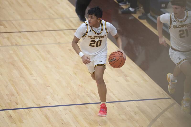 Joliet Catholic’sJames Pilapil takes the ball upcourt against Plainfield South on Wednesday, Jan. 17th, 2024 in Joliet.