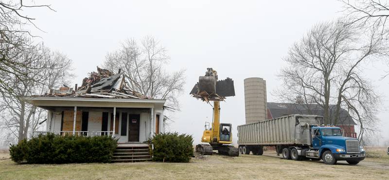 Debra from the Peck farm house at 64 Peck Road in Geneva is loaded into a truck during the demolition on Wednesday, March 22, 2023.