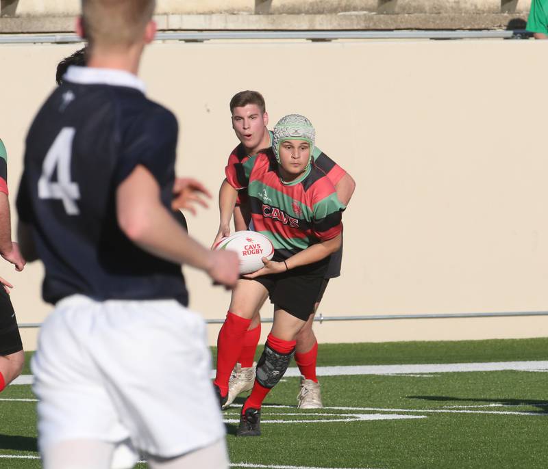 La Salle-Peru's Ian Whitehead carries the ball against La Salette Academy during a rugby game on Wednesday, April 12, 2023 at Howard Fellows Stadium at L-P High School.