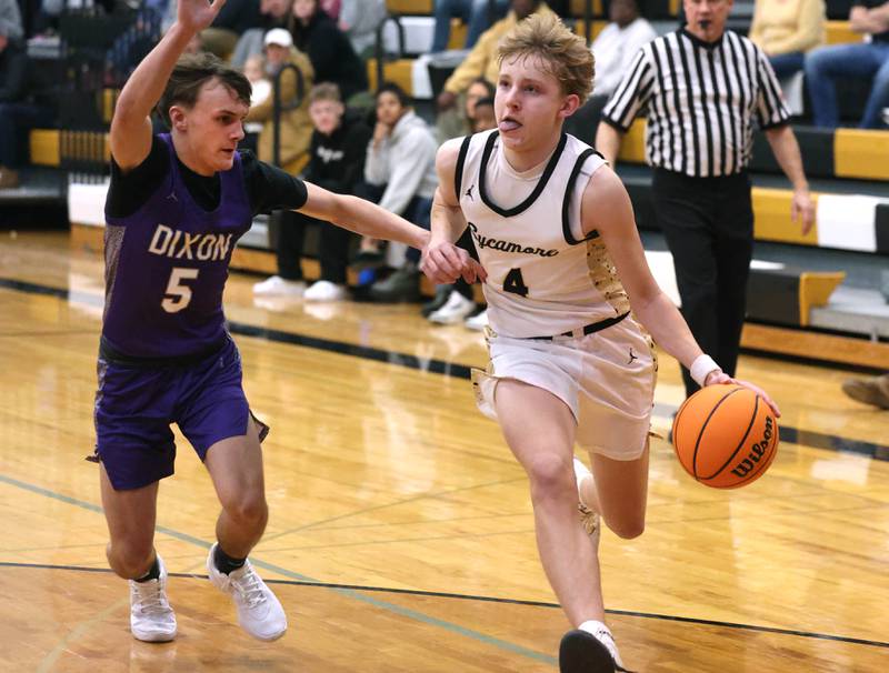 Sycamore's Isaiah Feuerbach goes baseline against Dixon’s Brady Feit during their game Tuesday, Jan. 14, 2025, at Sycamore High School.