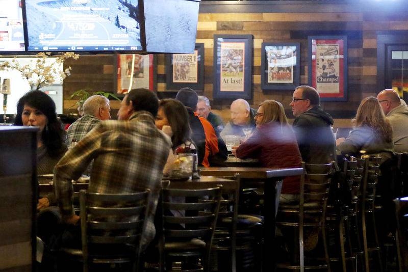 Restaurant patrons pack Oliver's on Friday on Main Street in Woodstock.