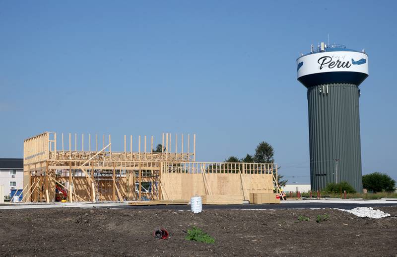 Crews begin on erecting the walls of the new Popeye's location next to Super 8 on Monday, Aug. 2024 in Peru.