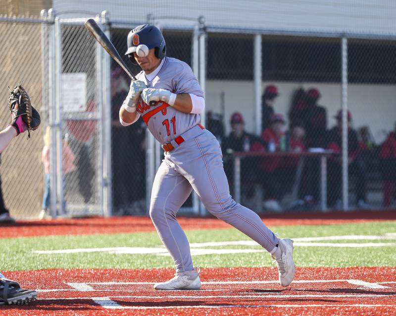 Oswego's Isaiah Logan (11) is hit by a pitch during baseball game between Oswego at Yorkville. Thursday, May 8, 2025 in Yorkville.