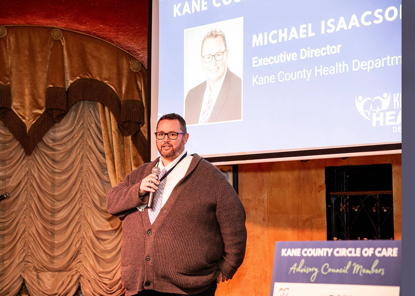 At the launch of the Kane County Circle of Care on Jan. 15, linking social service providers for at-risk families and youths, Michael Isaacson, director of the Kane County Health Department, explains how teamwork can make services and programs more accessible to the community.