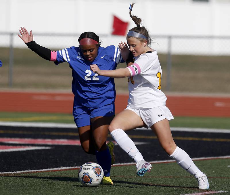 Jacobs' Delaney Roimiser tires to take a shot on goal as Larkin’s Jateme Owens defends during a nonconference Huntley Invite girls soccer match Tuesday, March 28, 2023, at Huntley High School.