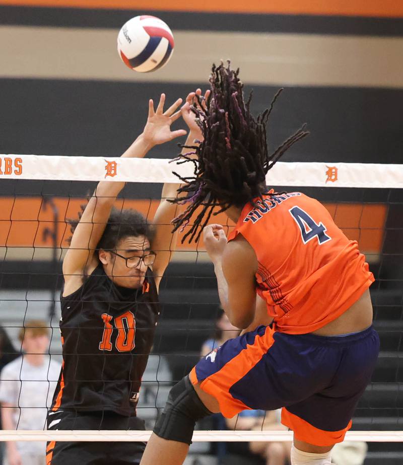 DeKalb’s Semaj Cooper tries for a block Tuesday, April 21, 2026 during their match against Naperville North JV at DeKalb High School.