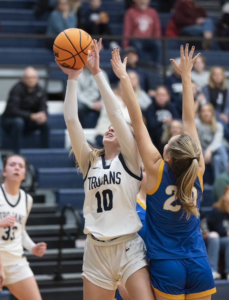 Cary-Grove's Alivia Nielsen shoots over Lake Forest's Charlotte Axus during the Class 3A Cary-Grove Regional Girls Basketball Championship game on Thursday, February 20, 2025 in Cary. Ryan Rayburn for Shaw Local