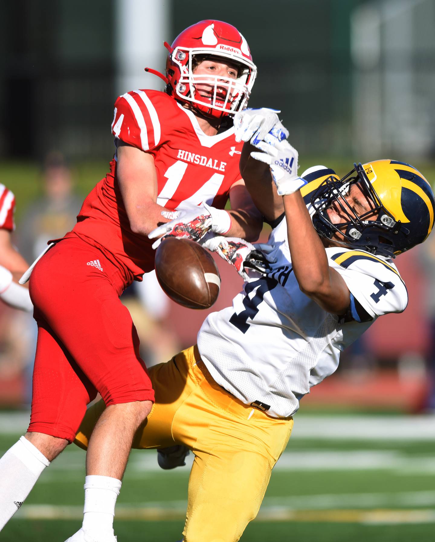 Hinsdale Central's Gavin Vande Lune, left, breaks up a pass intended for Glenbrook South's Carmelo Livatino during the second round of the Class 8A high school football playoffs in Hinsdale Saturday.