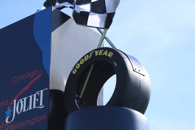 A Good Year tire and checkered flag sit atop the new Route 66 sculpture along South Chicago Street at the Route 66 Raceway on Tuesday, May 12, 2026 in Joliet.