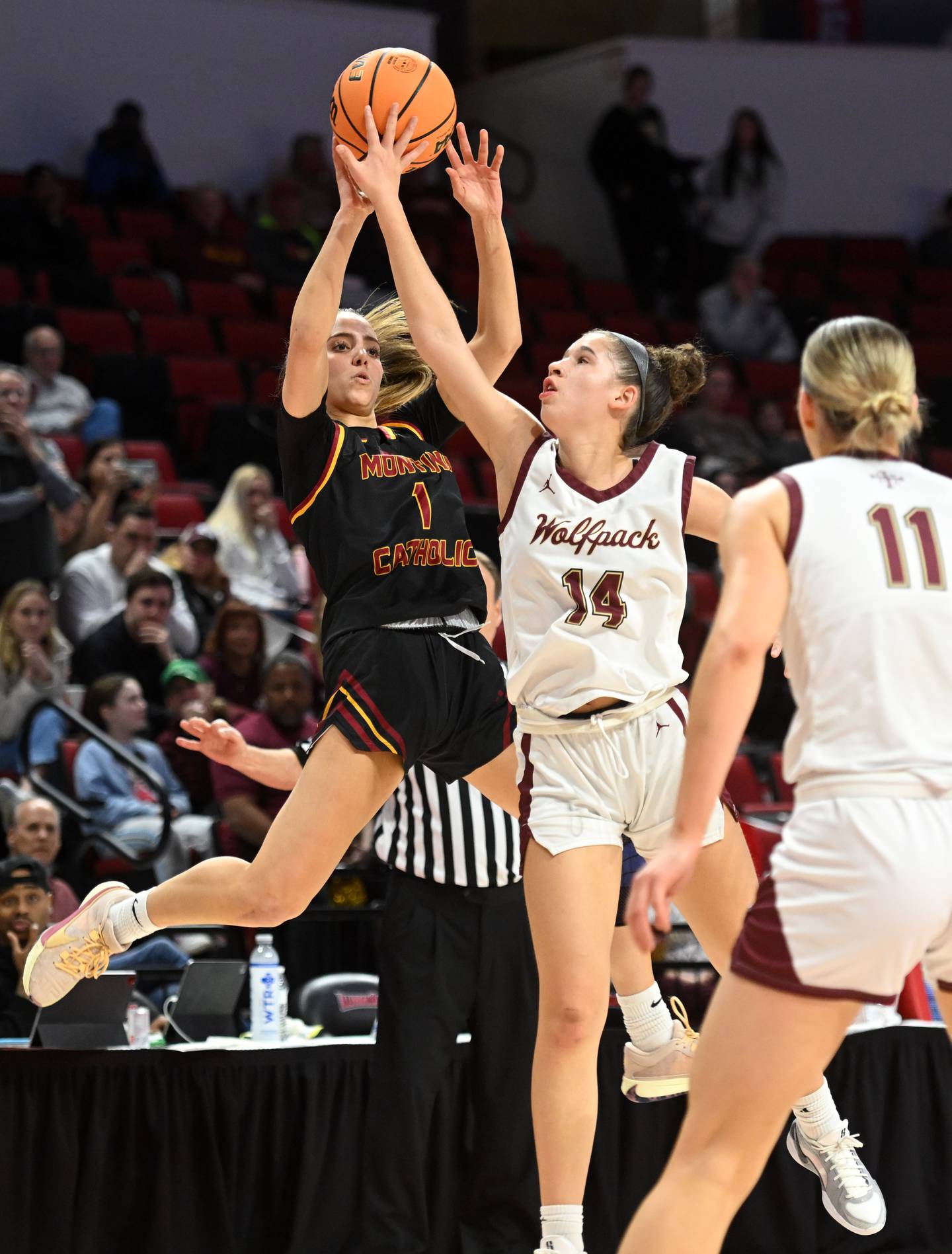 Montini's Nikki Kerstein, left, attempts to shoot against St. Ignatius' Isabella Keberlein during the IHSA Class 3A girls state basketball championship game at CEFCU Arena on Saturday, March 8, 2025 in Normal.
