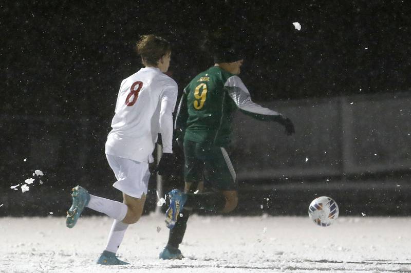 Crystal Lake South's Ali Ahmed races to kick the ball into the goal in front of Timothy Christian's Trevor Munk during the IHSA Class 2A Grayslake Central Supersectional soccer match on Tuesday, Oct. 31, 2023, at Grayslake Central High School.