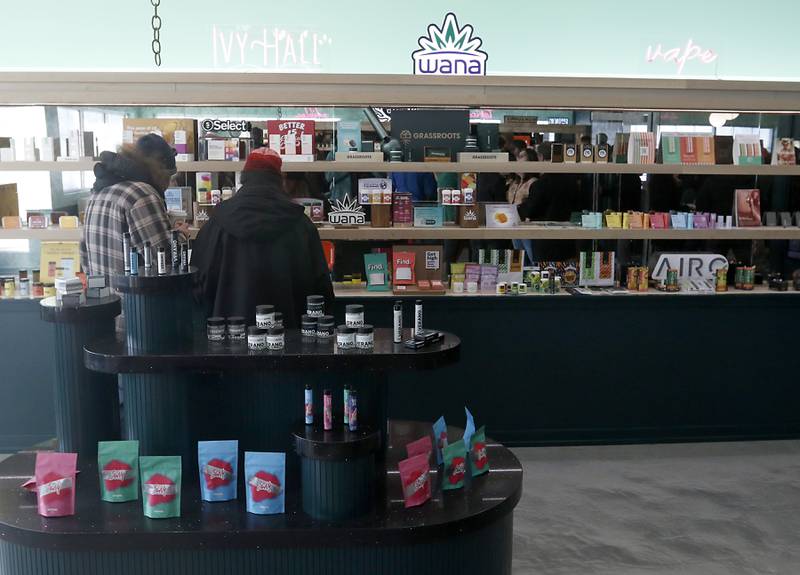 People look at available products during an open house Thursday, Feb. 2, 2023, at the Ivy Hall Crystal Lake, a social equity-licensed cannabis dispensary that recently opened at 501 Pingree Road in Crystal Lake.