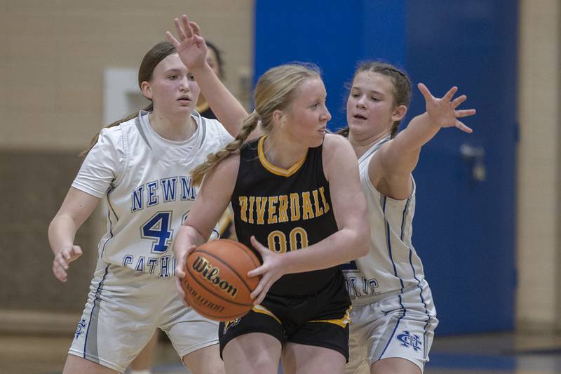 Newman’s Lauryn Francque (left) and Lucy Oetting guard Riverdale’s Alexis Duke Thursday, Feb. 2, 2023.