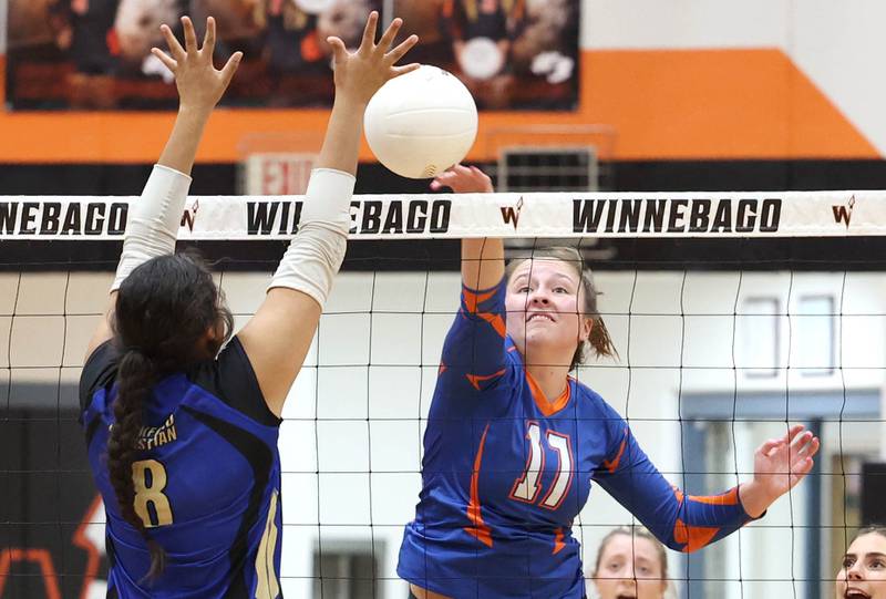 Genoa-Kingston's Lily Mueller spikes the ball past a Rockford Christian blocker during their Class 2A sectional semifinal match Monday, Oct. 31, 2022, at Winnebago High School.