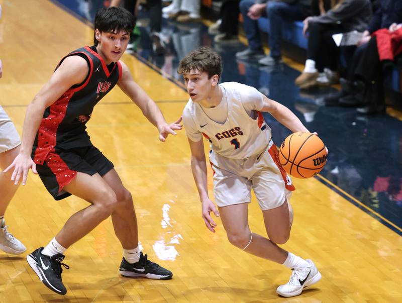 Genoa-Kingston's Kash Sunderlage goes by Indian Creek's Cooper Rissman during their game Friday, Jan. 2, 2026, at Genoa Kingston High School.