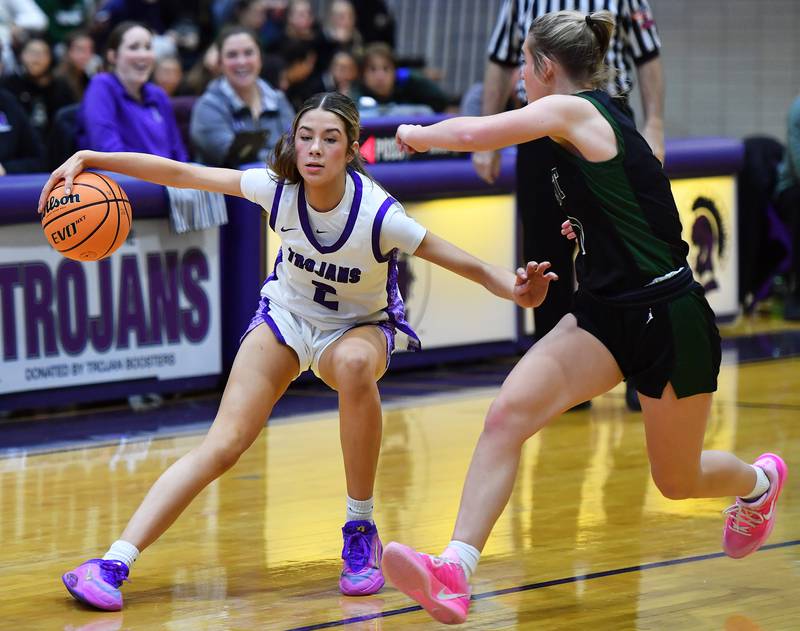 Downers Grove North’s Eva Yerkovich (2) puts a move on Glenbard West’s Nina Hendricksen during a game on January 17, 2026 at Downers Grove North High School in Downers Grove .