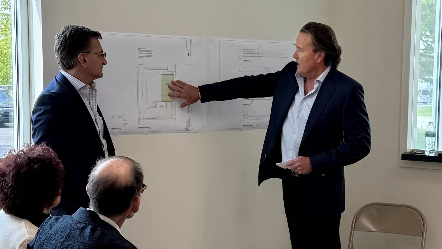 Compact Industries President Michael Brown goes over the details of a $3.2 million, 33,000-square-foot expansion project for their distribution center at 420 37th Ave. in St. Charles during a groundbreaking ceremony on Wednesday May 7, 2025.