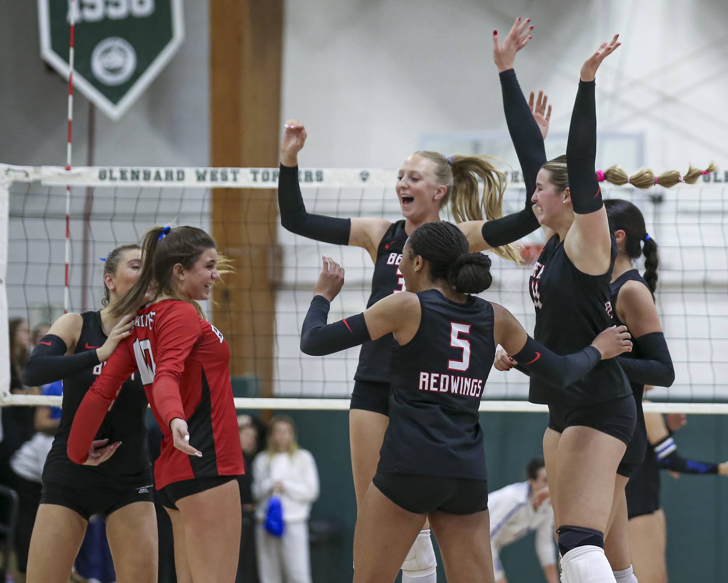 Benet celebrates a point over St Charles North in their Class 4A Glenbard West Sectional final volleyball match. Nov 6, 2025 in Glen Ellyn.