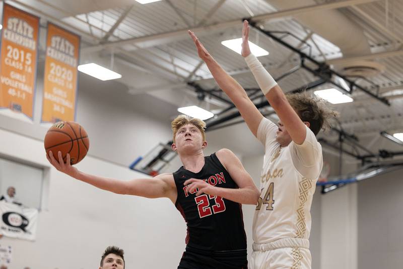 Fulton’s Ethan Price puts up a shot over Pecatonica’s Korbin Gann Tuesday, Feb. 28, 2023 in the Eastland 1A sectional semifinal.