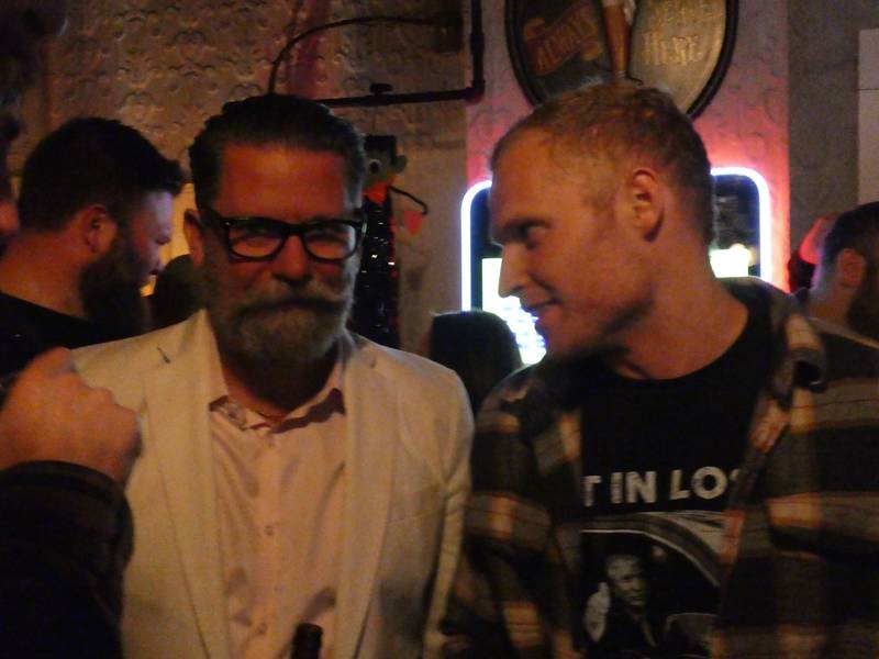 Attendees gather outside for a pop-up meet-and-greet Gavin McInnes in McHenry on Thursday, Oct. 20, 2022. McInnes went to Ye Olde Corner Tap after his planned show at the Vixen was cancelled over his controversial past, including his founding of the Proud Boys.