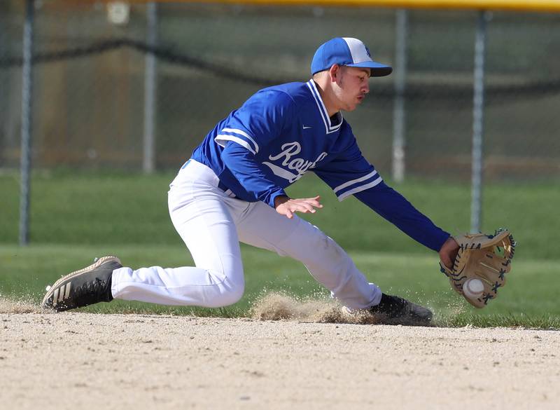 Hinckley-Big Rock's Matthew Badal makes a sliding play Tuesday, April 29, 2025, during their game at Hiawatha High School in Kirkland.