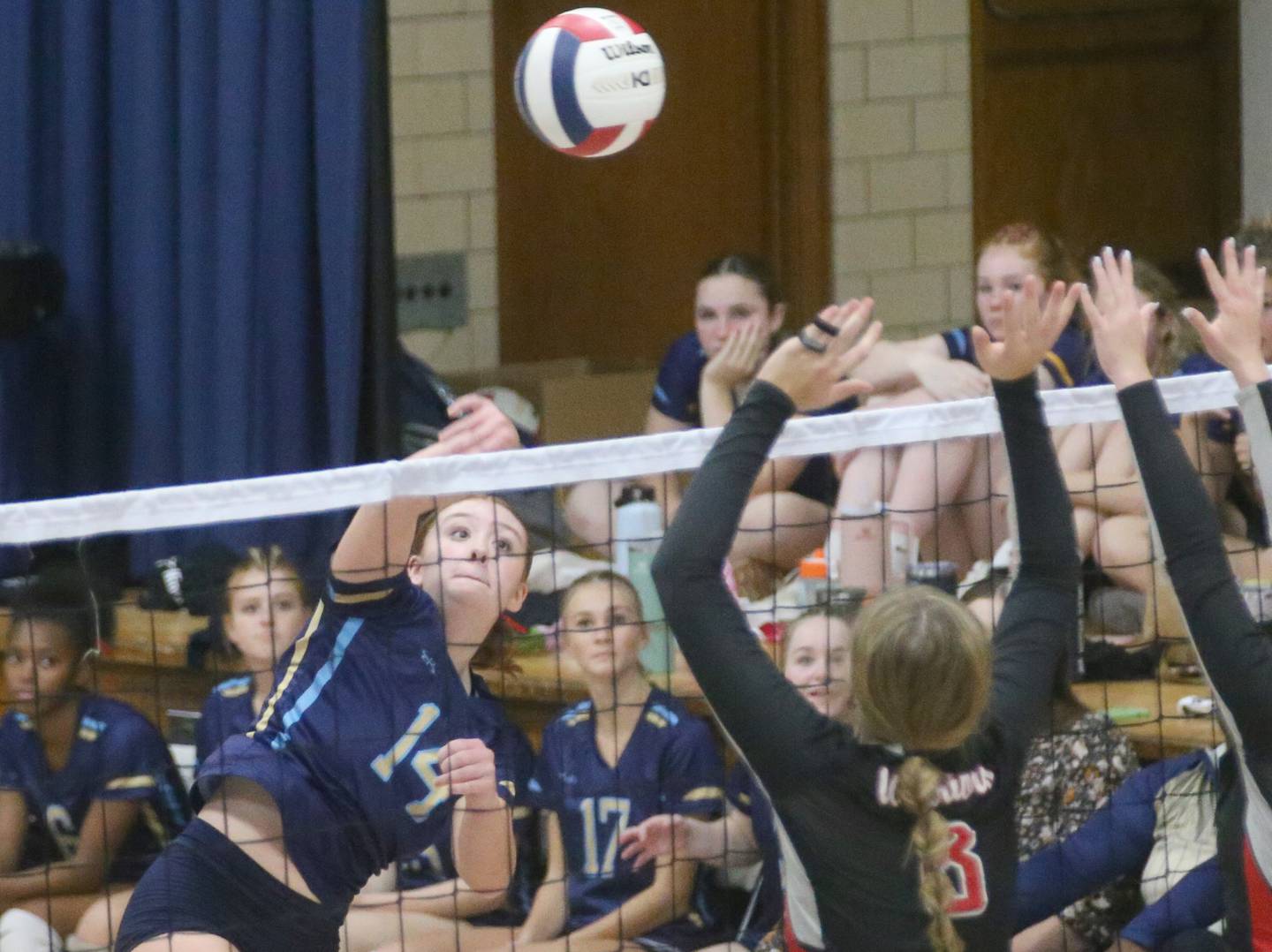 Marquette's Marea Jimenez spikes the ball past Woodland's Grace Longmire on Thursday, Oct. 19, 2023 at Bader Gym.