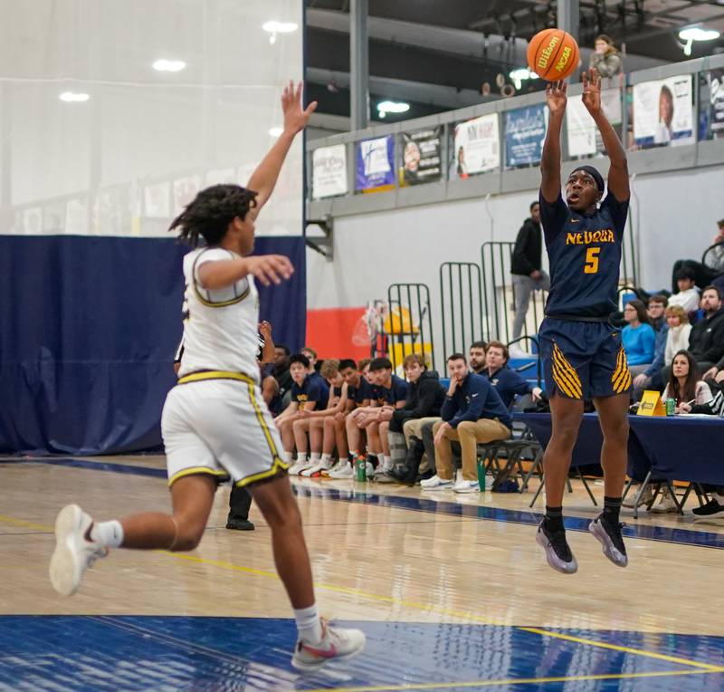 Neuqua Valley's David Taiwo (5) shoots a three pointer against Yorkville Christian during a basketball game at Yorkville Christian High School on Tuesday, February 4, 2025.