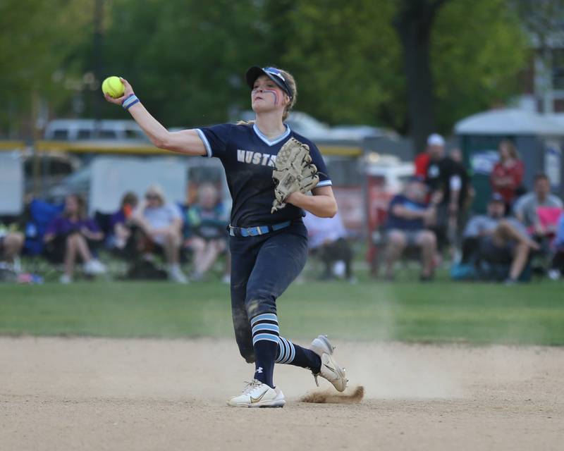 Downers Grove South's Grace Taylor (9) throws to first for an out during varsity softball game between Downers Grove South at Downers Grove North.  May 11, 2023.