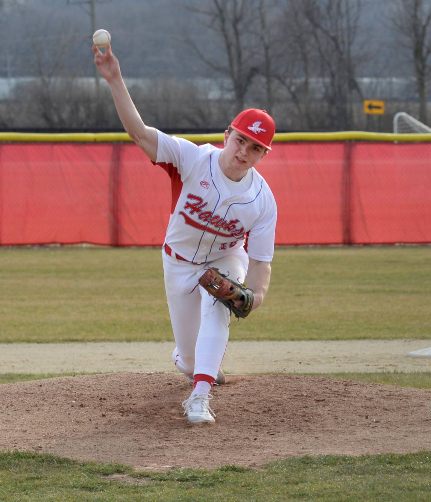 Oregon's Jack Washburn pitches against Warren during the Hawks' opener on Tuesday, March 12, 2024 at the Oregon High School baseball field.