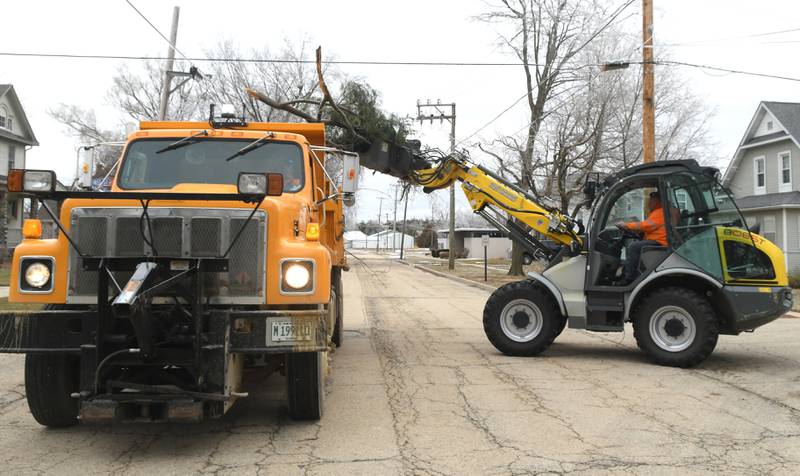 Mt. Morris village workers were busy Thursday cleaning up after an ice storm, coupled with strong winds, knocked down branches and trees. Strong winds continued across the region Thursday causing more electrical outages.