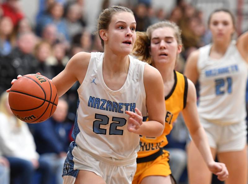 Nazareth's Gracie Carstensen drives the baseline during the ESCC conference tournament championship game against Carmel on Feb. 4, 2023 at Nazareth Academy in LaGrange Park.