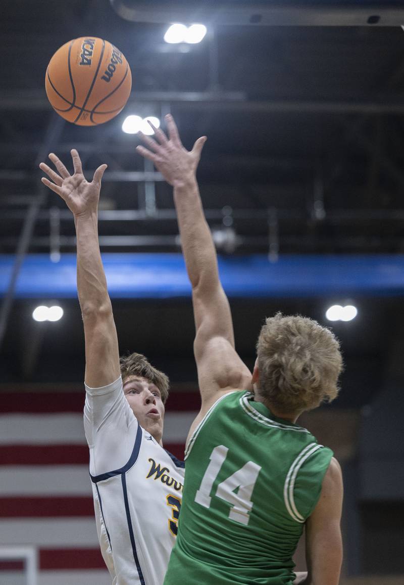 Sterling’s Jack Saathoff puts up a shot over Geneseo’s Jack Kreiss Friday, Dec. 5, 2025.