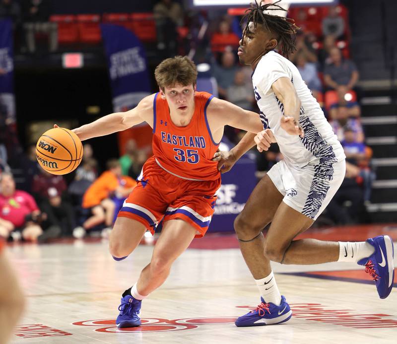 Eastland's Parker Krogman drives by Chicago Hope Academy's Trentyn McGinnis during their IHSA Class 1A state championship game Saturday, March 15, 2025, in the State Farm Center at the University of Illinois in Champaign.