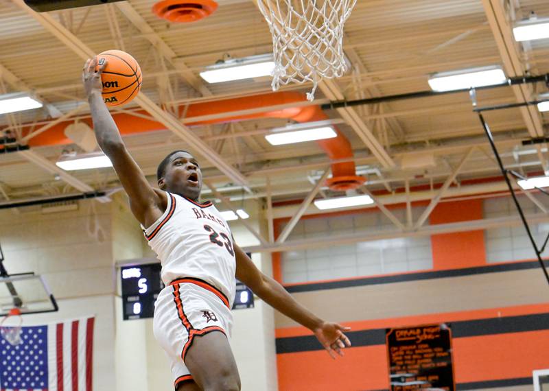 DeKalb's Davon Grant (23) flies toward the basket against Glenbard West during a game in DeKalb on Wednesday, Dec. 4, 2024.