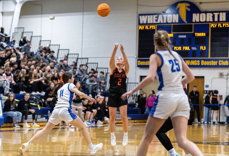 Wheaton Warrenville South’s Brooke Ittersagen shoots a three-point field goal during a game against Wheaton North on Friday, Dec. 20, 2024.