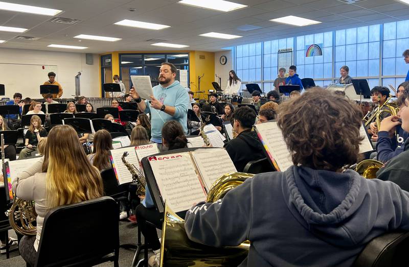 Challand Middle School Band instructor Kevin O'Keefe leads student musicians through a rehearsal.