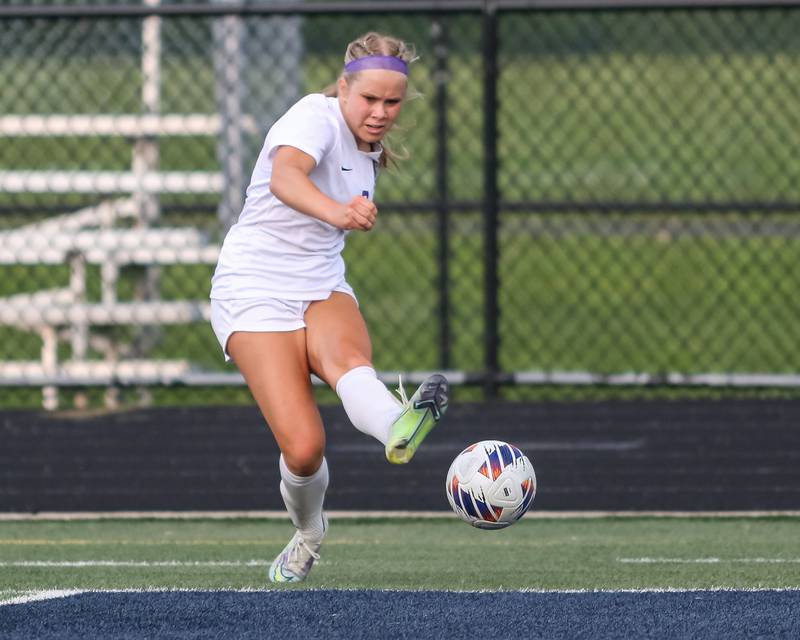 Downers Grove North's Kate Goray (9) kicks on goal during Class 3A Addison Trail Regional final soccer match between Downers Grove South at Downers Grove North.  May 19, 2023.