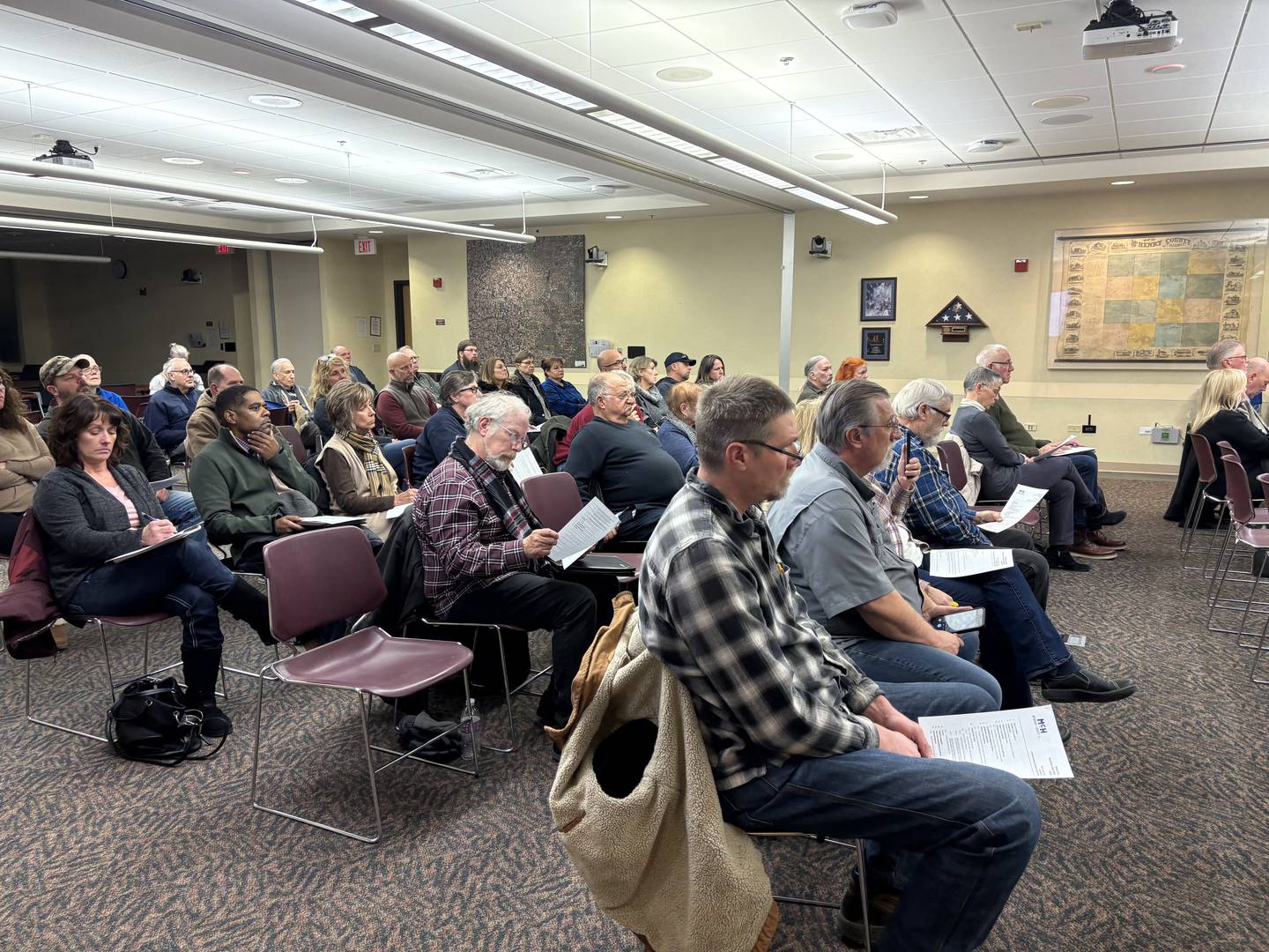 Residents listen at the McHenry County Board meeting Tuesday, Feb. 18, 2025.