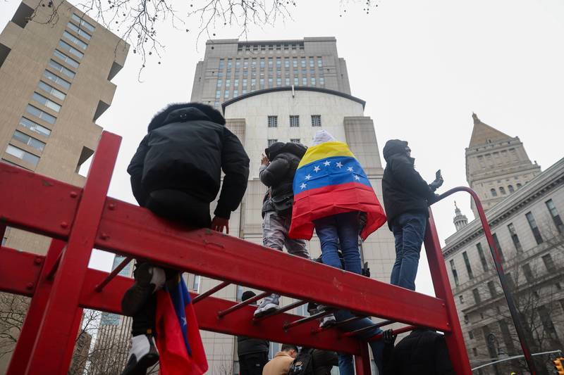 People protest outside Manhattan Federal Court before the arraignment of Venezuelan President Nicolas Maduro, Monday, Jan. 5, 2026, in New York. (AP Photo/Heather Khalifa)