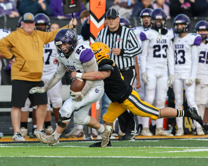 Dixon's Eli Davidson (27) runs down the sideline after a catch during Class 4A second round playoff football playoff game between Dixon at St Laurence.  Nov 4, 2023.