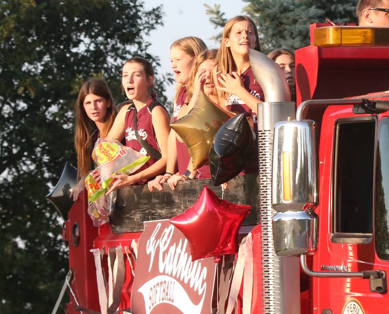 Peru Catholic School softball players ride in the St. Bede Homecoming Parade on Friday, Sept. 29, 2023 at St. Bede Lane.